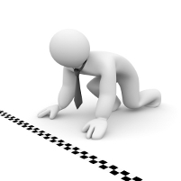 Cartoon figure on hands and knees at a chequered starting line